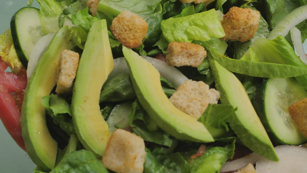 Fresh salad with avocado and cucumber