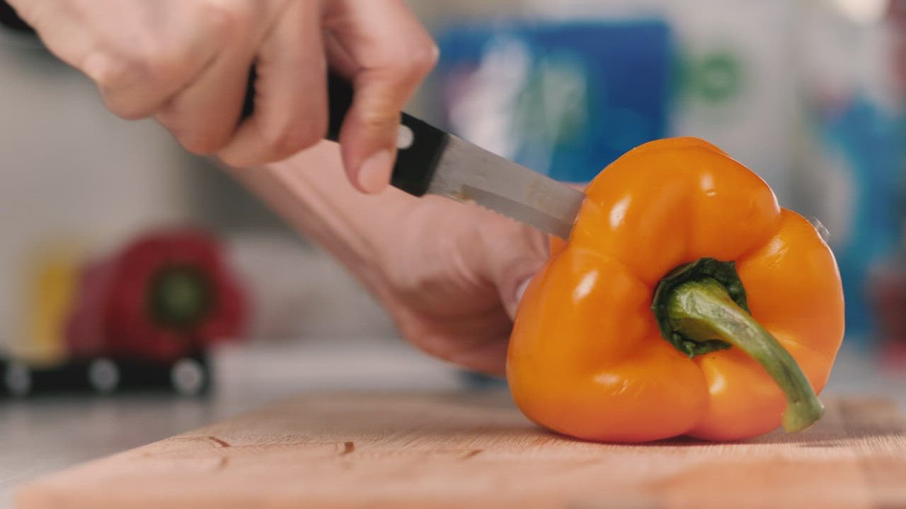 Slicing a yellow bell pepper