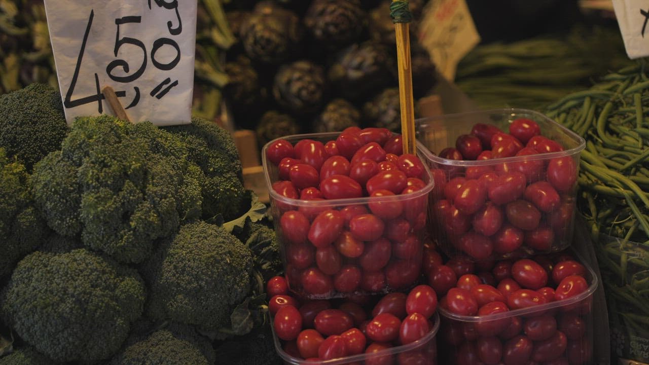 Fresh broccoli and cherry tomatoes at the market